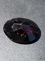 Top view of oval faceted garnet