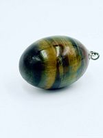 Front view of oval tiger’s eye pendant showing chatoyancy