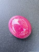 Ruby gemstone front lit showing color and polish