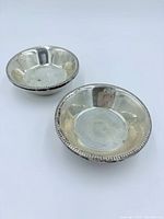 Top view of both weighted silver bowls