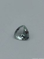 Loose light green trilliant spinel gemstone front view