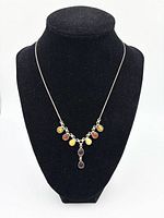 Necklace on bust showing overall design and colours