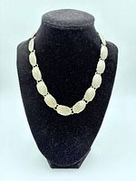 Necklace displayed on bust to show link design and overall appearance