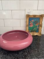 Planter and framed print together for scale and context