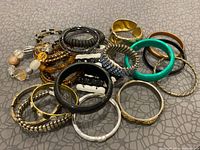 Full view of assorted bangles and bracelets spread out