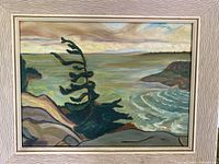 Full view of framed painting showing landscape scene and frame design