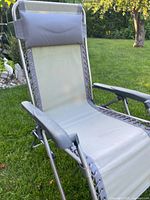 Front view of grey zero gravity lounge chair on lawn