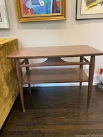 Full view of wooden two-tier table front and top