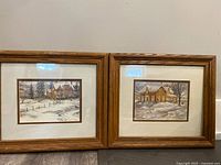 Both framed Tricia Romance prints side by side