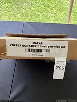 Box label showing 'RAZAB COPPER NON STICK 11 Inch pan with Lid', made in China.