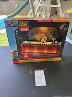 Front view of the boxed Super Mario Deluxe Bowser Battle Playset showing key branding and visual details including Bowser figure and music notes.