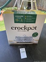 Front view of Crockpot slow cooker box showing 2.5 quart oval casserole crock with diamond pattern and product features.