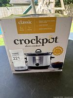 Front of the Crockpot box showing brand, size, features, and image of the slow cooker unit.