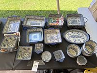 Overview of all Temptations serving dishes on table showing variety of shapes and sizes with floral blue and yellow patterns