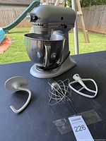 Full view of mixer with bowl and attachments laid out