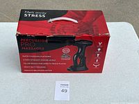 Original red product box showing features and handle on top.