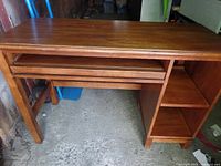 Front view of the Ethan Allen wooden desk showing keyboard tray and two open shelves on the right side.