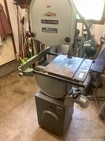 Front view showing full band saw, table surface and wheeled base