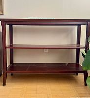 Front view of dark wood 3-shelf bookcase