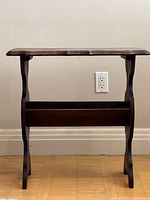 Front view of wood side table with magazine rack