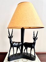 Full view of lamp with shade showing both antelope figures