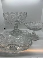 All three cut glass pieces grouped to show scale and patterns