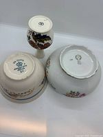 Bottom marks of Johnson Bros bowl, Royal Worcester vase, Reichenbach dish