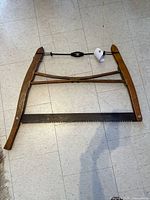 Full view of wooden bow saw