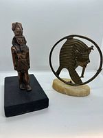 Both brass Egyptian sculptures together