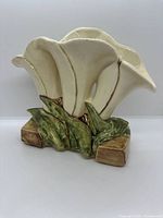 Front view of McCoy vase showing triple calla lily design, leaves and base