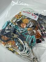 Entire sealed bag showing mixed necklaces