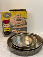 Front of box showing Tala branding and pans nested beside it