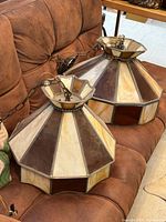 Both stained glass pendant lights side by side on couch