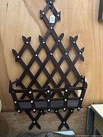 Full view walnut lattice wall pocket on wall