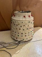 Full view of cylindrical flower pot lamp with chain and cord