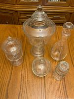 All five jars with lids displayed on wooden surface