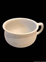 Side view showing overall shape and handle of ironstone chamber pot