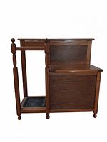 Front view of oak hall bench showing storage seat closed and umbrella stand