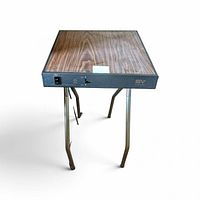 Three-quarter view showing entire projector table