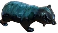 Left side view of glazed bear figurine