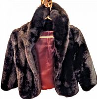 Front view of faux fur bolero showing collar and lining