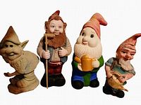 All four gnomes lined up to show variety and scale