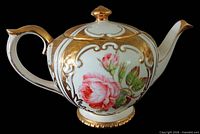 Left side view of Gibson's China teapot showing rose design, handle and spout