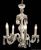 full view of five-arm crystal chandelier with prisms