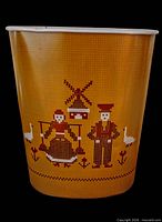 Full view of cylindrical wastebasket showing entire graphic