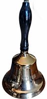 Full view of bell showing handle and reflective metal body