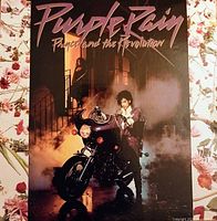 Front album cover with Prince on motorcycle