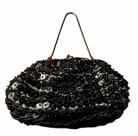 Front view showing sequin and bead embellishment and metal handle