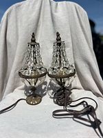 Front view of both crystal mini table lamps showing structure and bead strands.