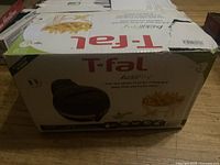 Original box showing product branding and image of fries being cooked in the fryer.